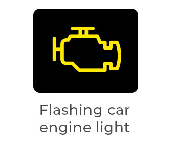 Flashing yellow engine warning light, which usually signals a severe engine misfire that can damage the catalytic converter. Stop driving as soon as it's safe.